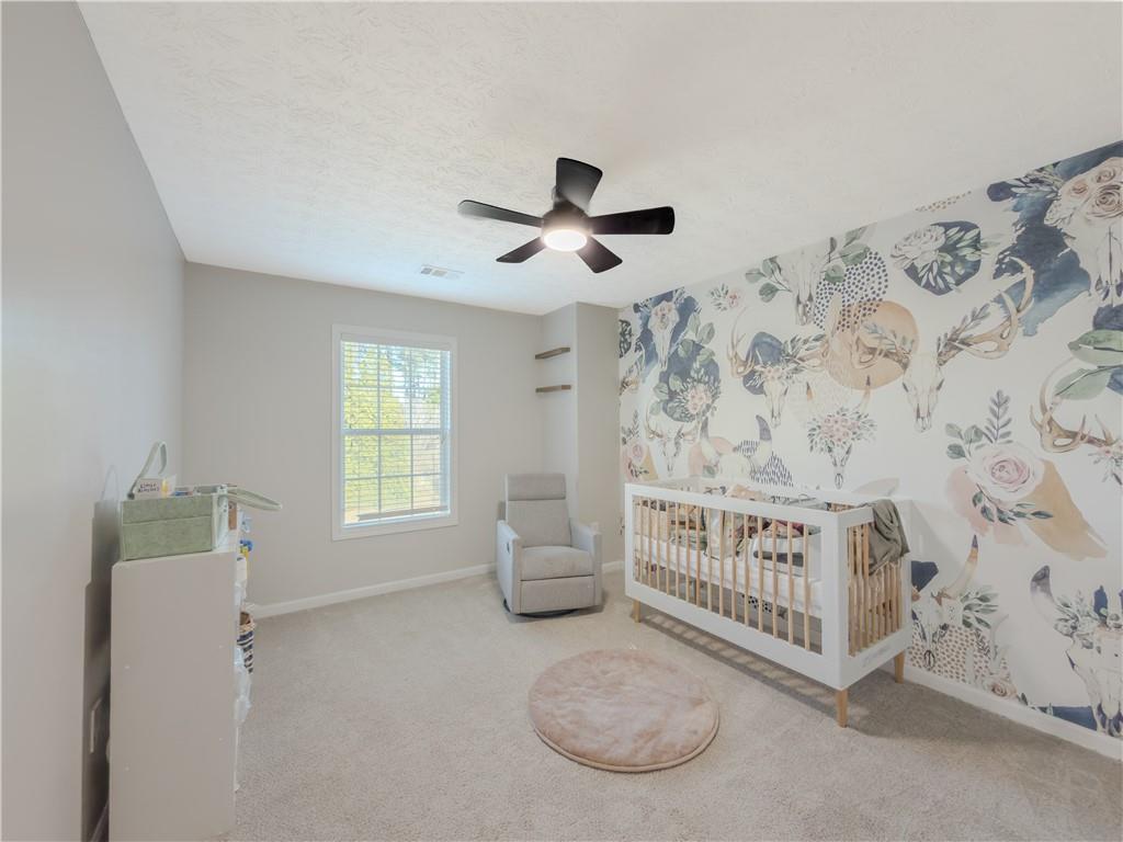 3100 Oak Ridge Lane Loganville, GA 30052 - Photo 29 of 43 a bedroom with furniture and a window