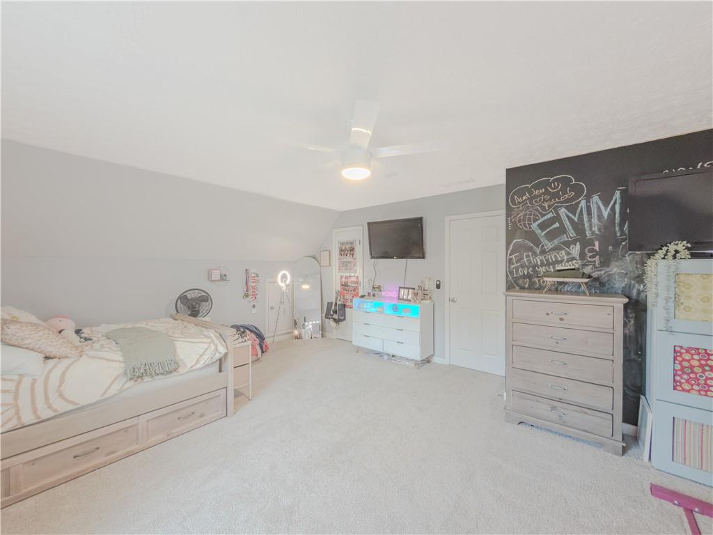 3100 Oak Ridge Lane Loganville, GA 30052 - Photo 31 of 43 a bathroom with a bathtub sink and mirror