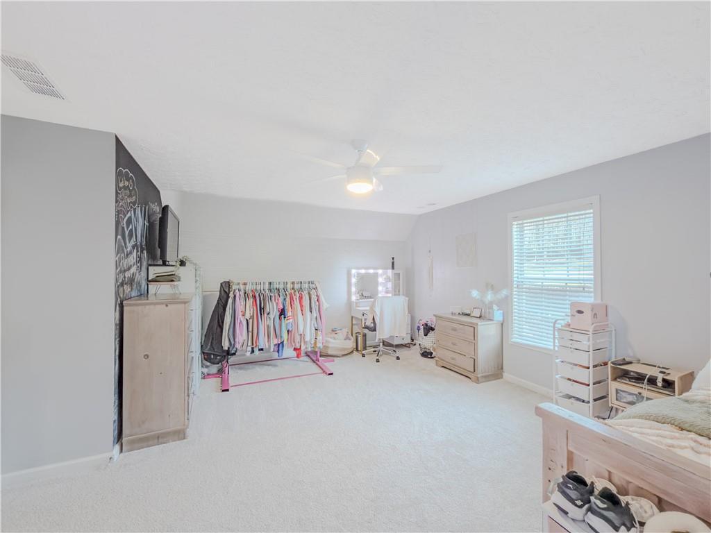 3100 Oak Ridge Lane Loganville, GA 30052 - Photo 32 of 43 a view of a livingroom with furniture and windows