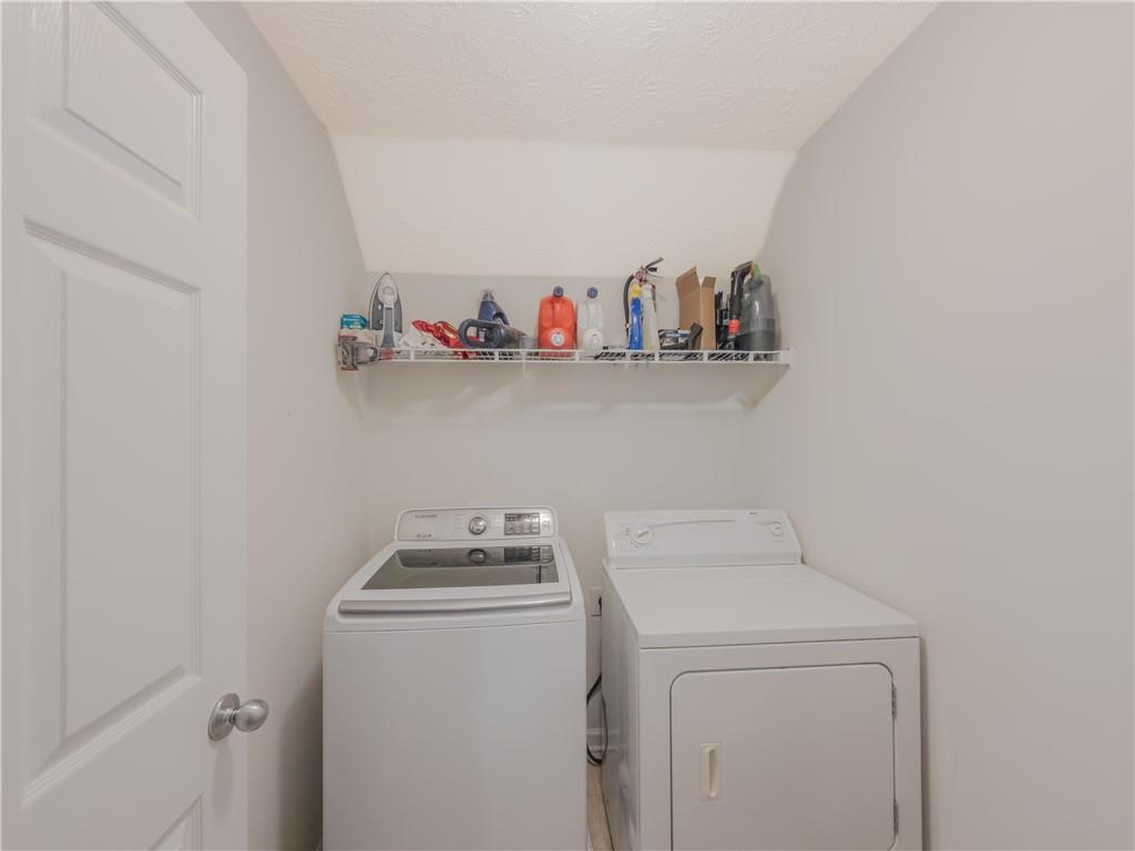 3100 Oak Ridge Lane Loganville, GA 30052 - Photo 33 of 43 a utility room with dryer and washer