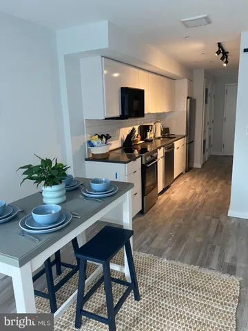 a kitchen with a sink and appliances