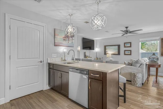 a kitchen with stainless steel appliances granite countertop lots of counter top space and cabinets