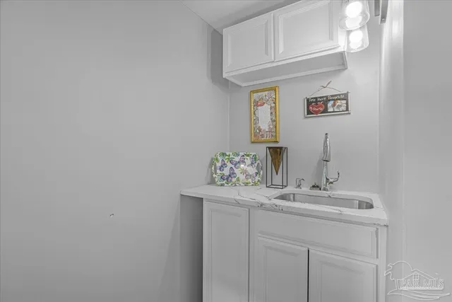 a view of a patio with table and chairs and potted plants