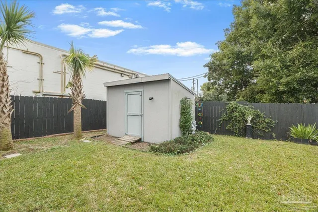 a porch with a table and chairs