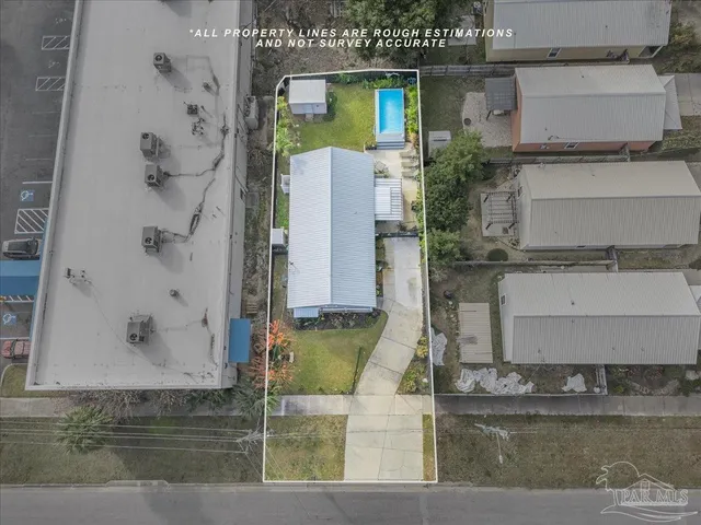 an aerial view of a house with a yard