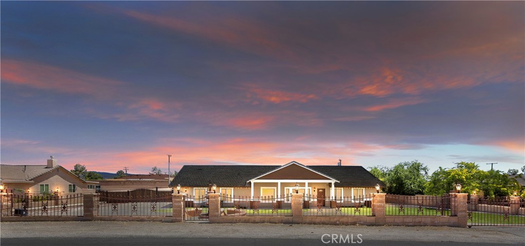 19265 Tomahawk Road Apple Valley, CA 92307 - Photo 1 of 1 a front view of a house with a yard