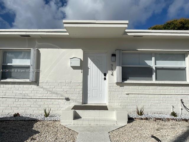 a bathroom with a tub and shower