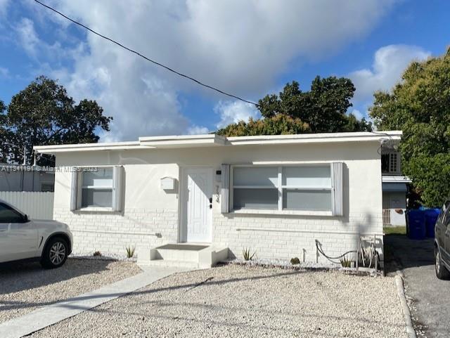 West Flagler Miami, FL 33125 - Photo 2 of 11 a front view of a house with a yard and garage