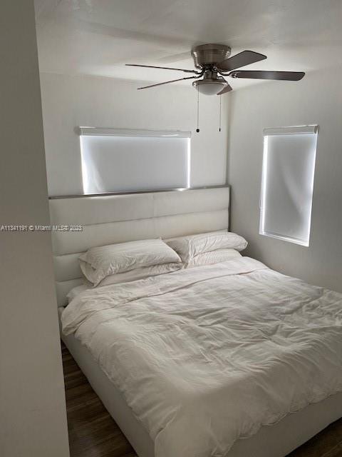 West Flagler Miami, FL 33125 - Photo 4 of 11 a bedroom with a bed and a dresser