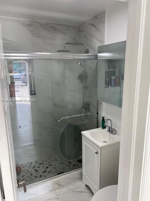 West Flagler Miami, FL 33125 - Photo 6 of 11 a bathroom with a sink a toilet and shower