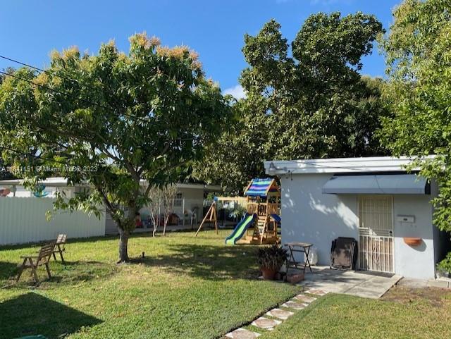 West Flagler Miami, FL 33125 - Photo 10 of 11 a view of a house with backyard and a tree