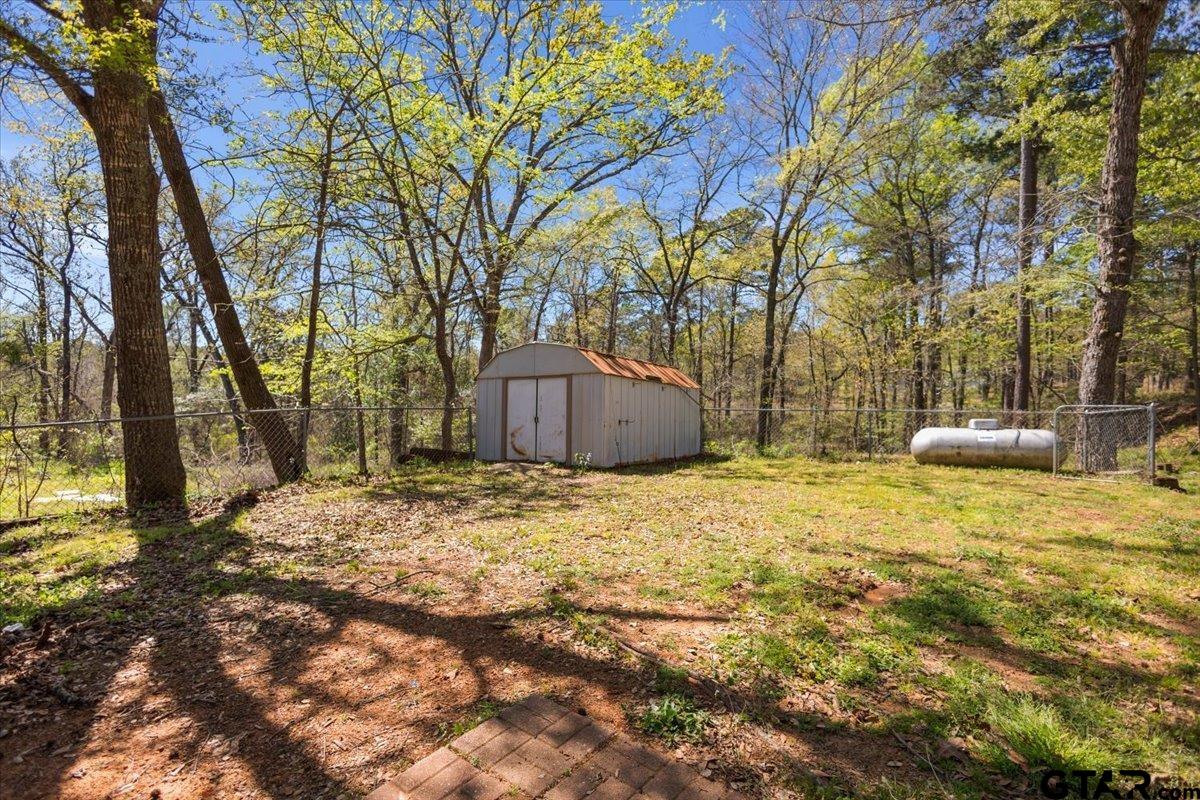 18607-c R 498 C R 498 Lindale, TX 75771 - Photo 40 of 41 a backyard of a house with trees and outdoor space