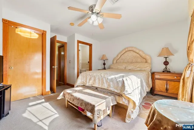 a bedroom with furniture and a window