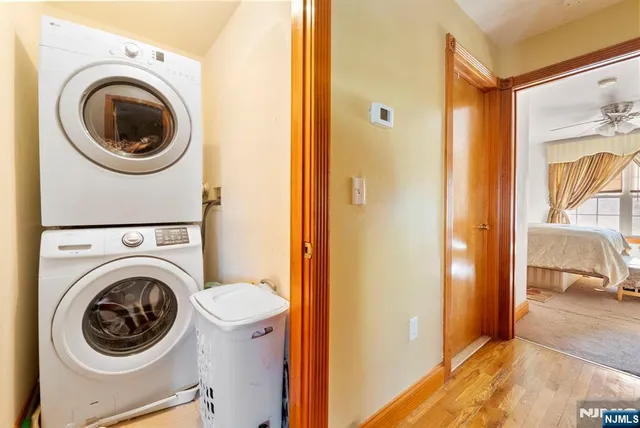 a view of a hallway with washer and dryer