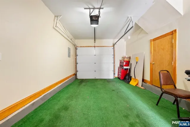 a view of a room with gym equipment and a window