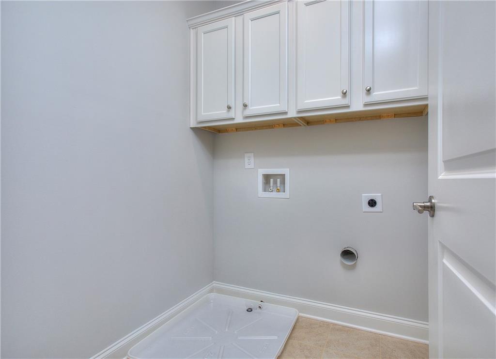 2604 Parkside Way Gainesville, GA 30507 - Photo 16 of 35 a bathroom with a sink and cabinets
