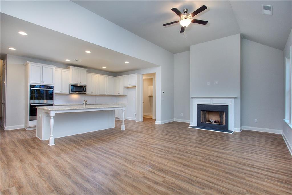 2604 Parkside Way Gainesville, GA 30507 - Photo 20 of 35 a view of kitchen with cabinets and wooden floor