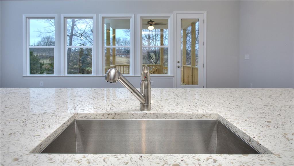 2604 Parkside Way Gainesville, GA 30507 - Photo 24 of 35 a view open kitchen with granite countertop a sink and a counter top space