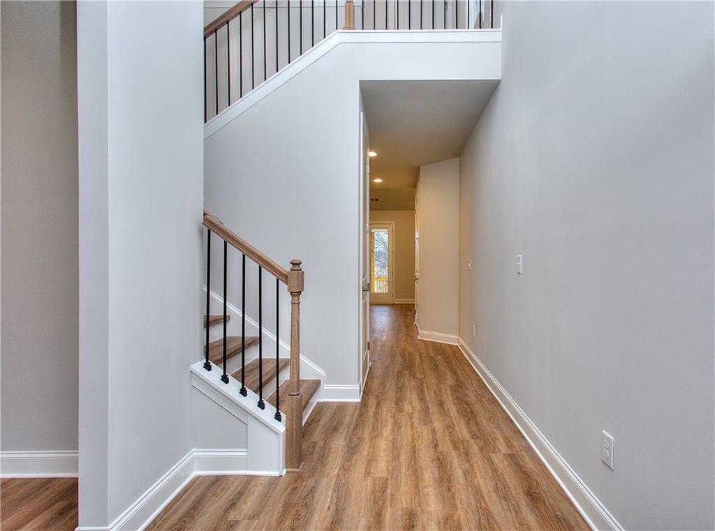 2604 Parkside Way Gainesville, GA 30507 - Photo 34 of 35 a view of a hallway with wooden floor and staircase