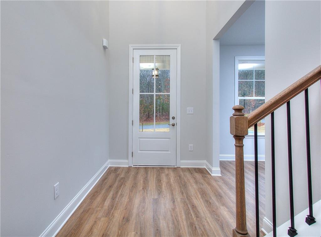 2604 Parkside Way Gainesville, GA 30507 - Photo 35 of 35 a view of an empty room with wooden floor and stairs