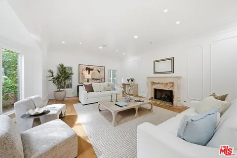 a kitchen with stainless steel appliances kitchen island granite countertop a sink and cabinets