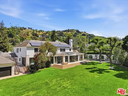 a aerial view of a house with a big yard