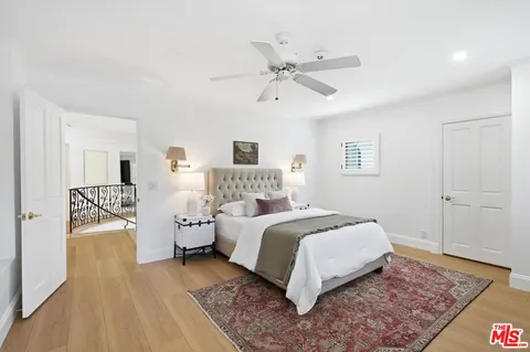 a large white kitchen with granite countertop lots of counter top space and furniture