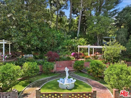a view of house with swimming pool