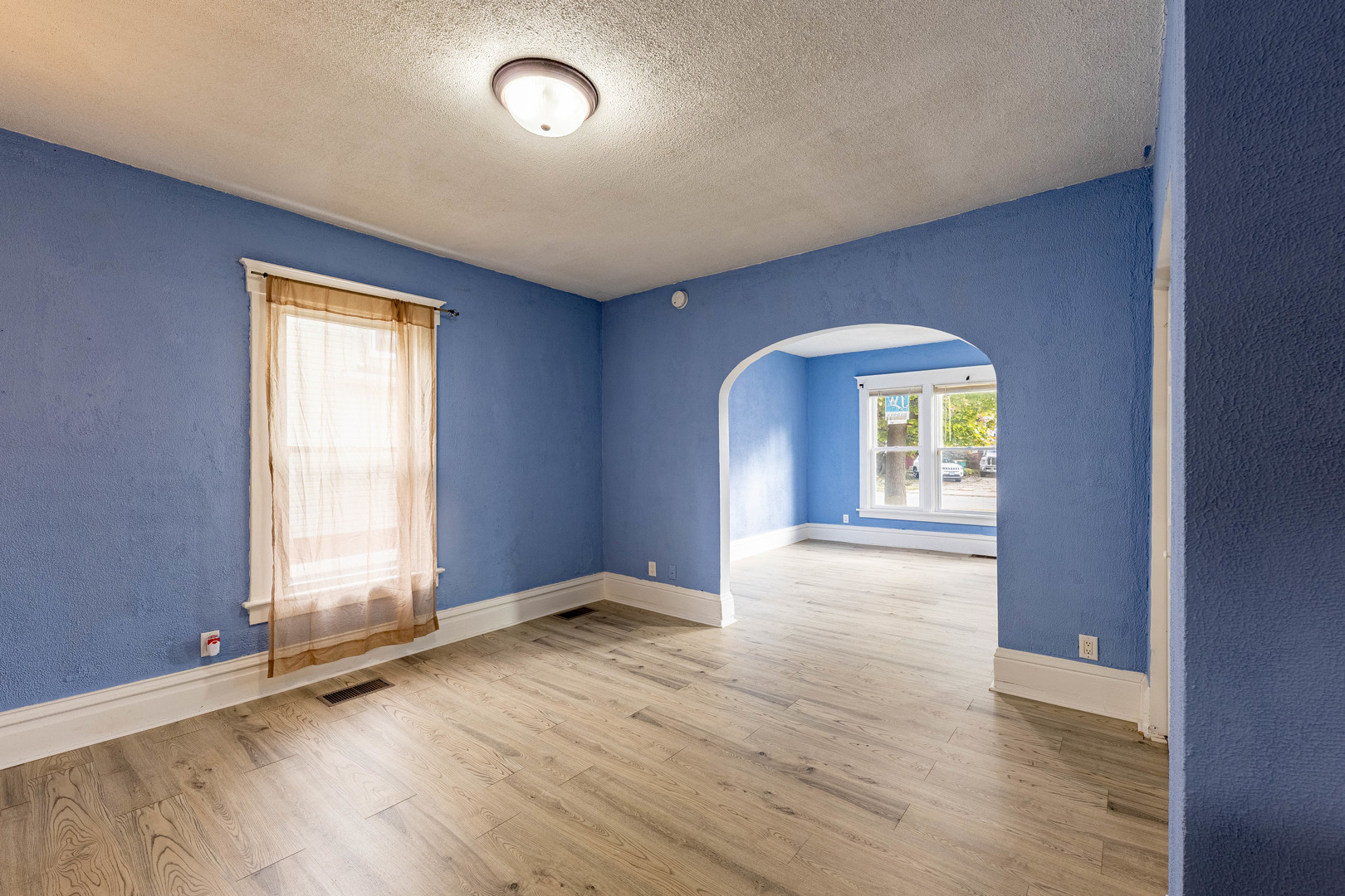2318 Gideon Avenue Zion, IL 60099 - Photo 11 of 30 an empty room with wooden floor and windows
