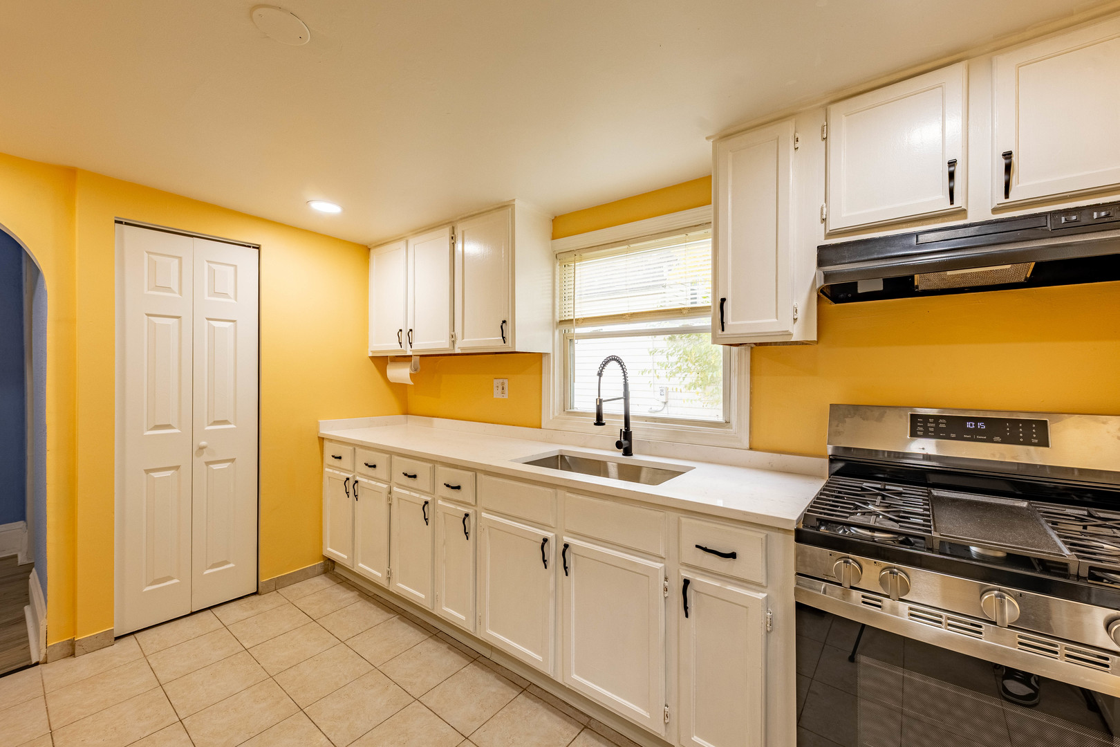 2318 Gideon Avenue Zion, IL 60099 - Photo 14 of 30 a kitchen with stainless steel appliances granite countertop a sink stove and cabinets
