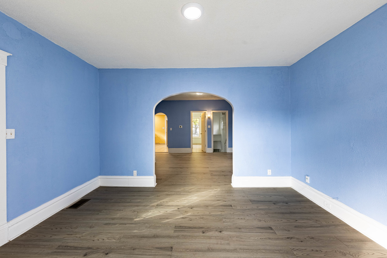 2318 Gideon Avenue Zion, IL 60099 - Photo 6 of 30 a view of empty room with wooden floor and fan