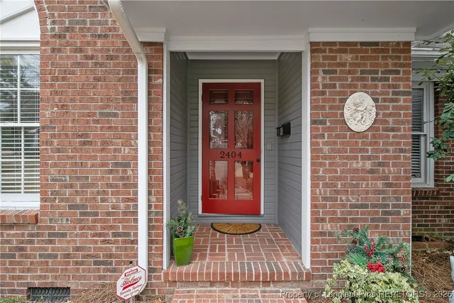 a view of a door with brick walls