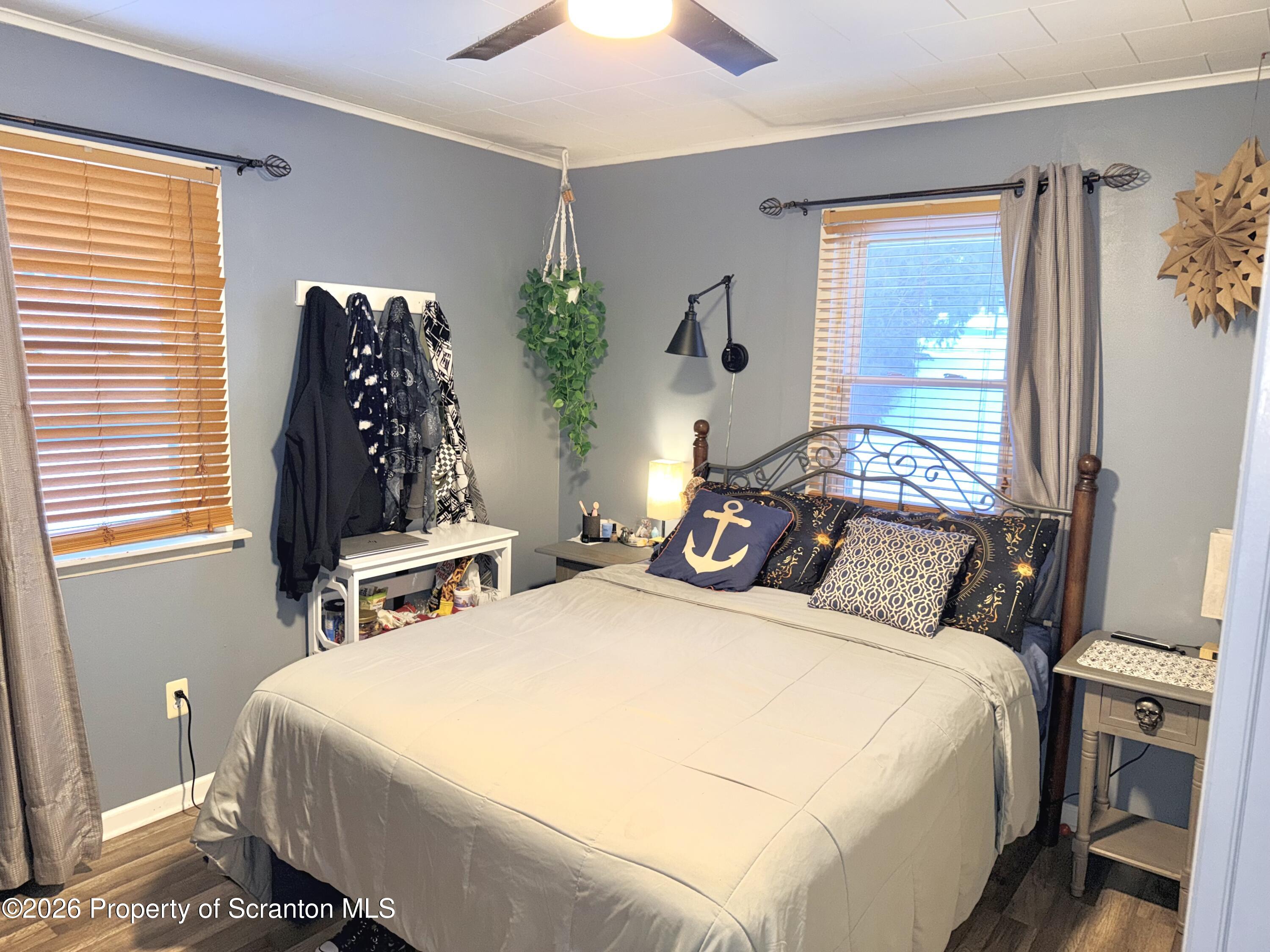 338 Bailey Street Clarks Summit, PA 18411 - Photo 13 of 24 a bedroom with bed and window