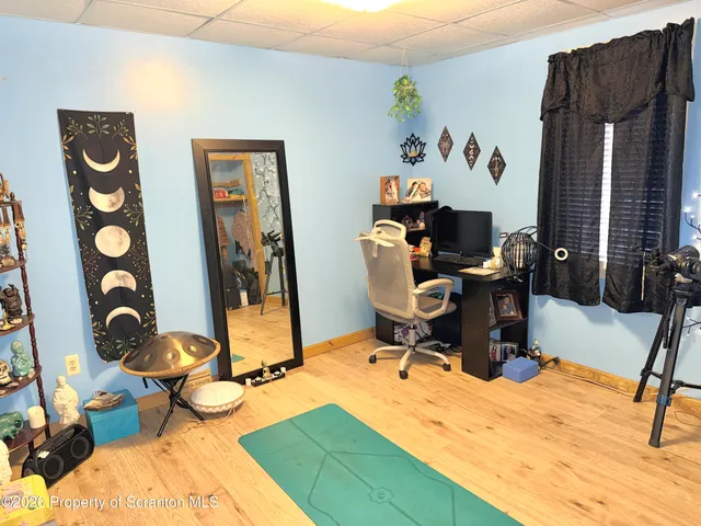 a view of a workspace with furniture and toys