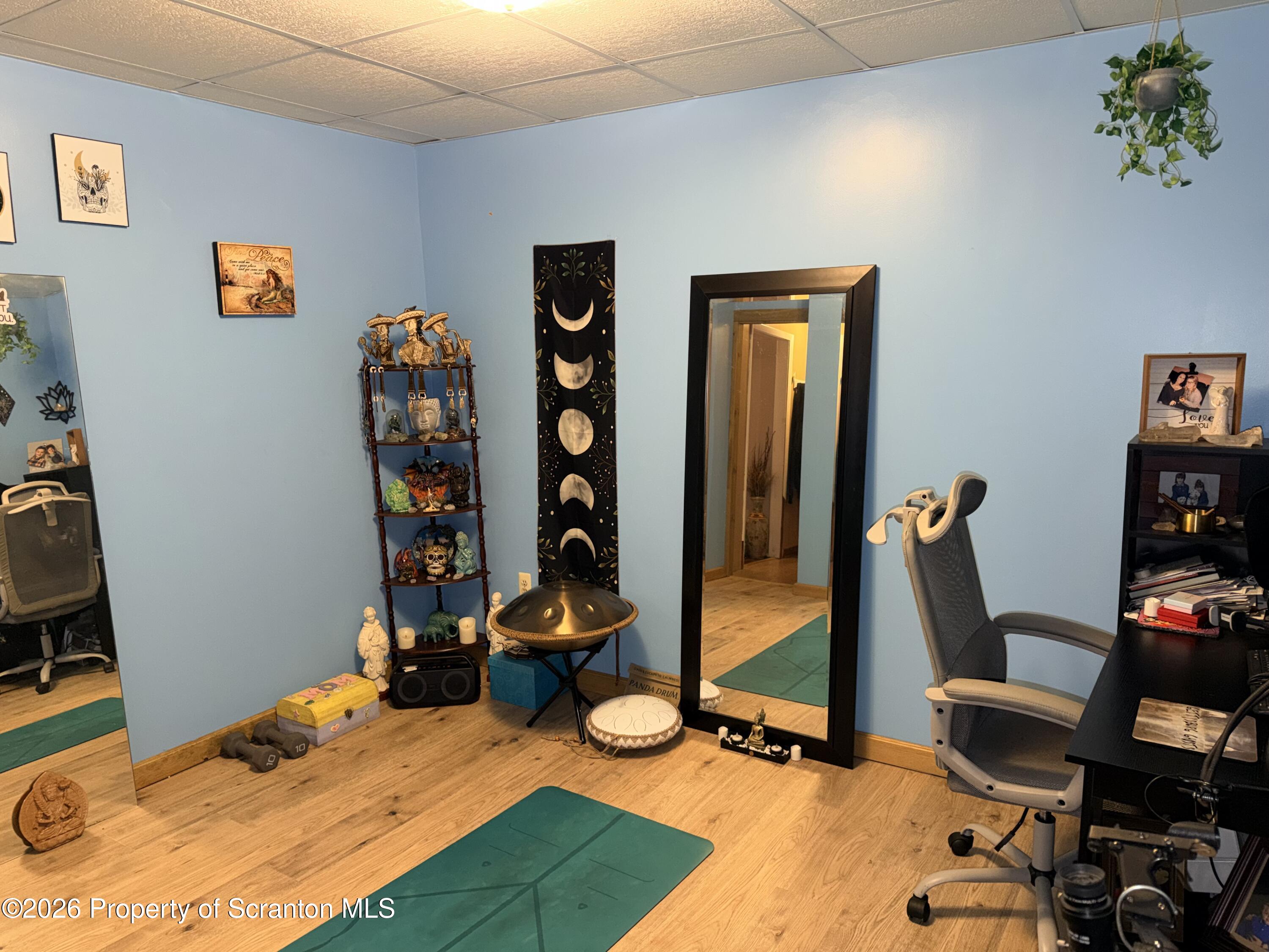 338 Bailey Street Clarks Summit, PA 18411 - Photo 16 of 24 a bedroom with furniture and a wooden floor