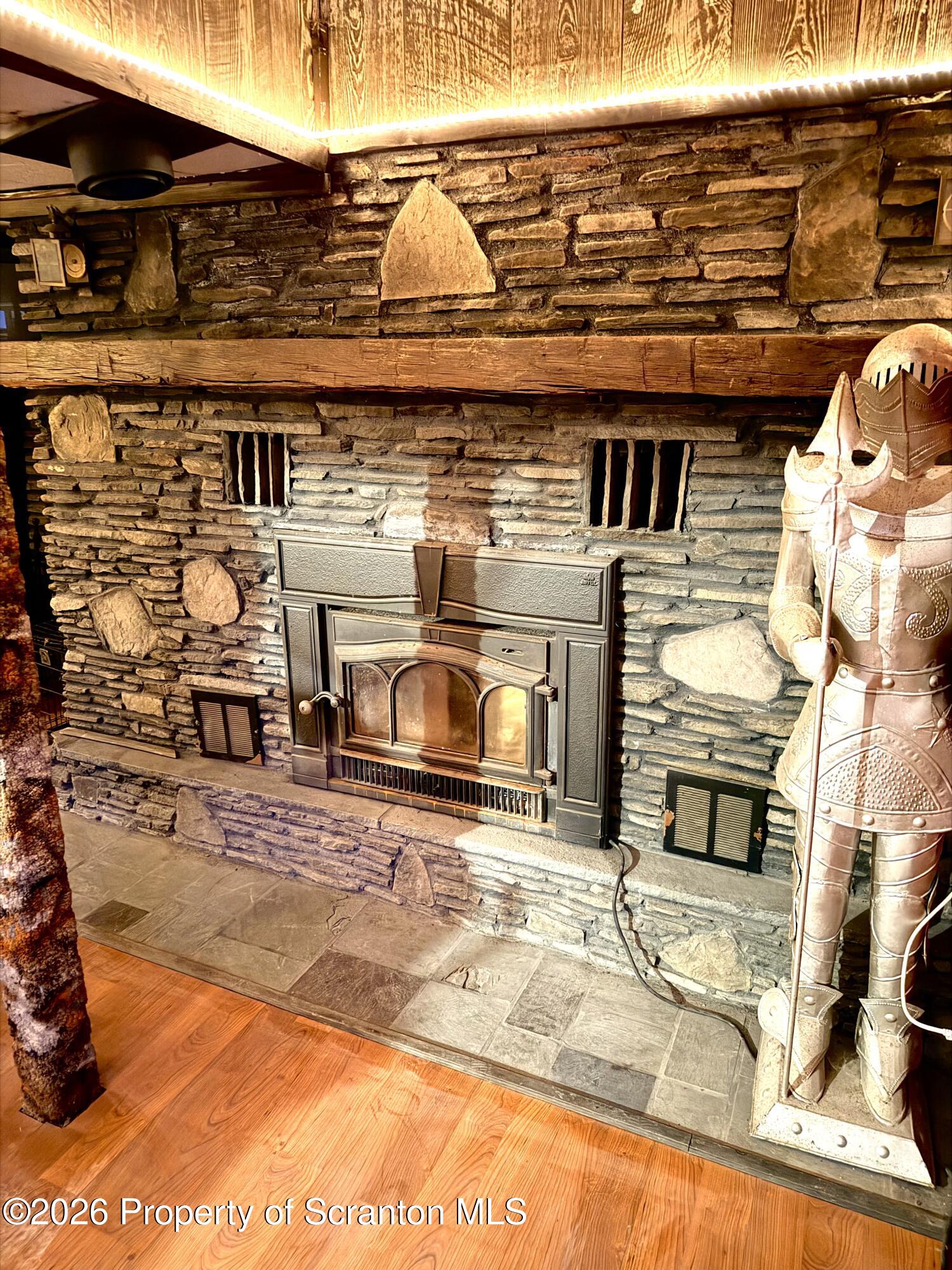 338 Bailey Street Clarks Summit, PA 18411 - Photo 18 of 27 a view of a fireplace and car parked