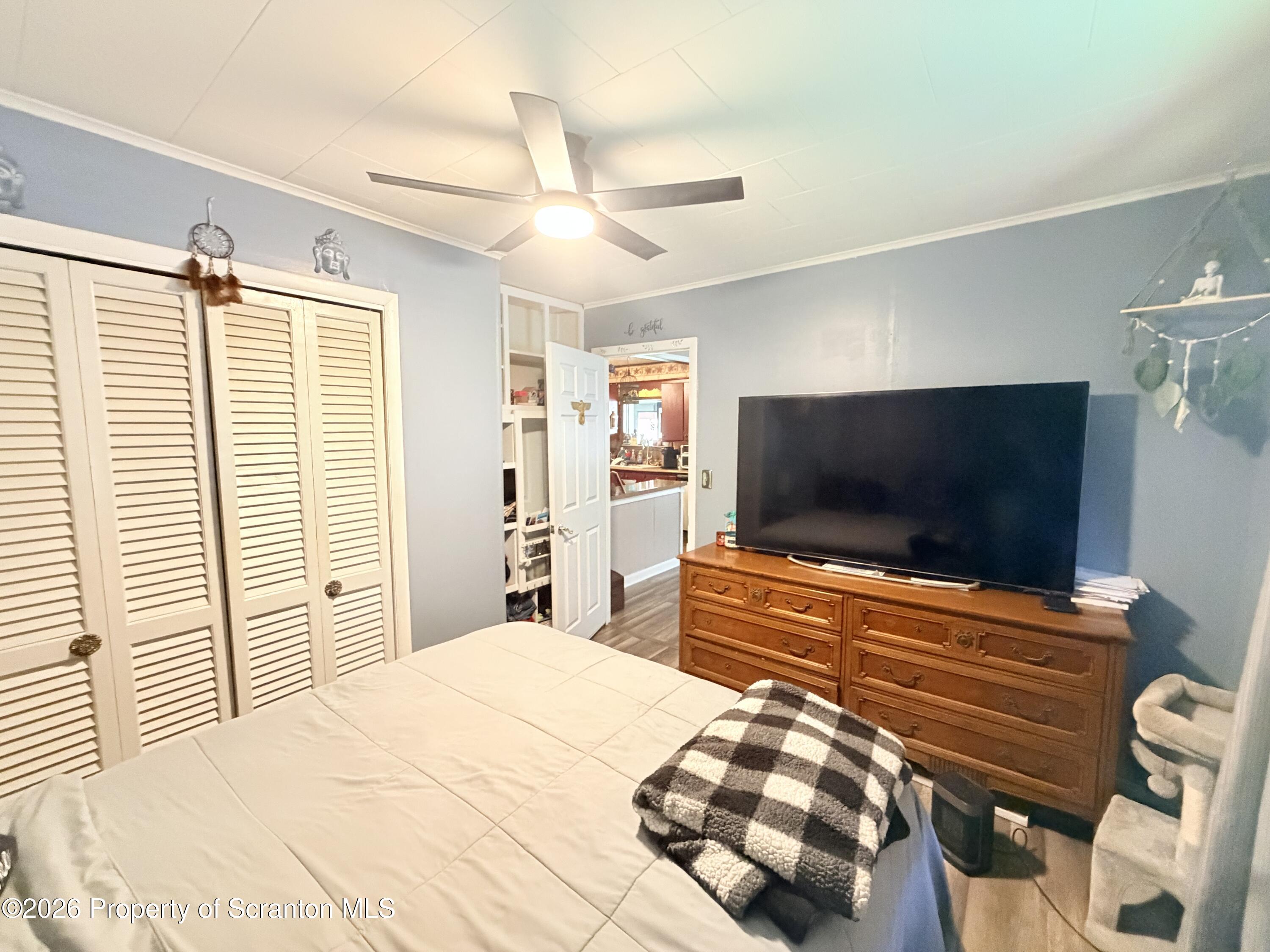 338 Bailey Street Clarks Summit, PA 18411 - Photo 18 of 24 a bedroom with a bed and a flat screen tv
