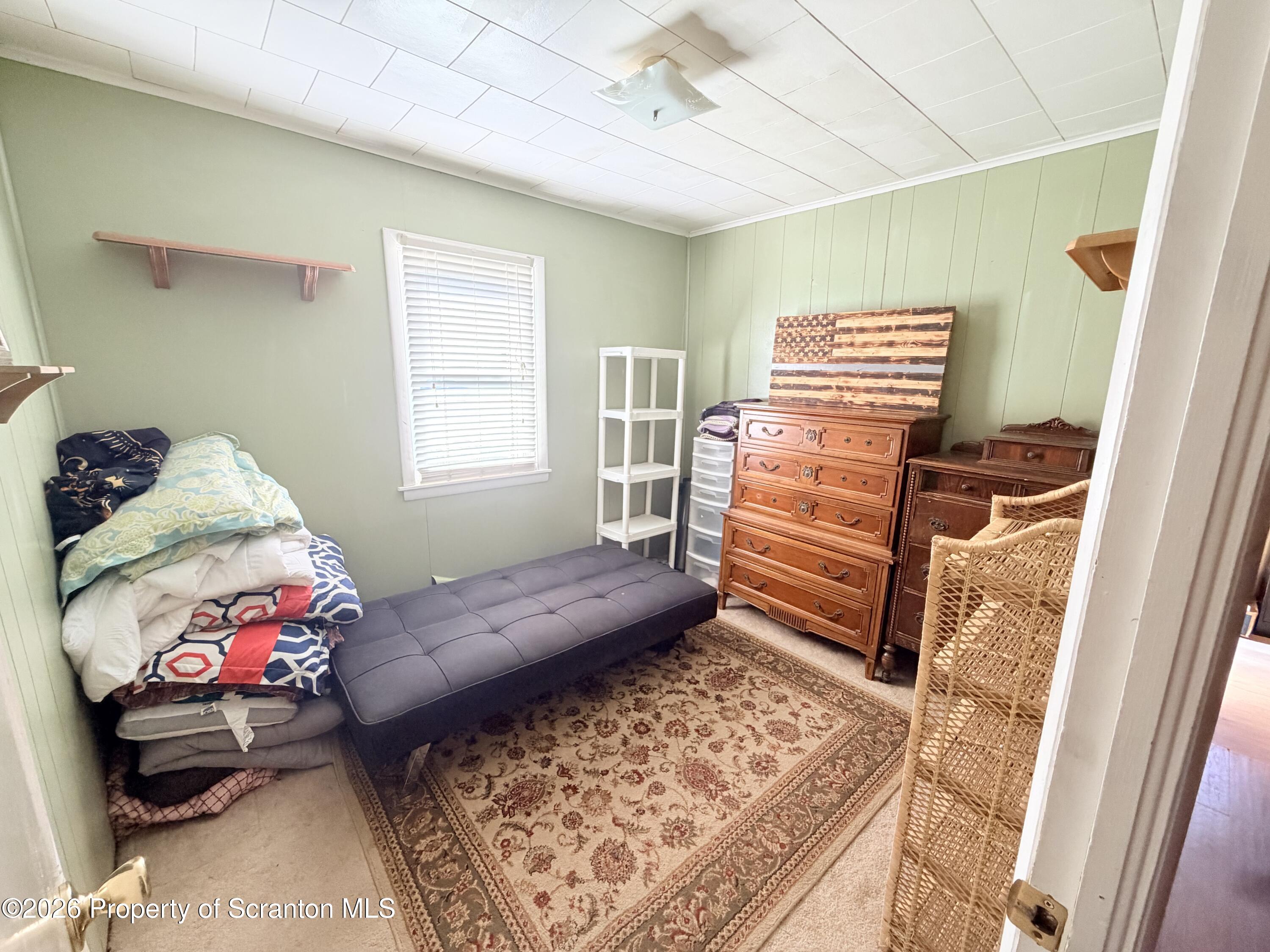 338 Bailey Street Clarks Summit, PA 18411 - Photo 19 of 24 a bedroom with a bed and a window