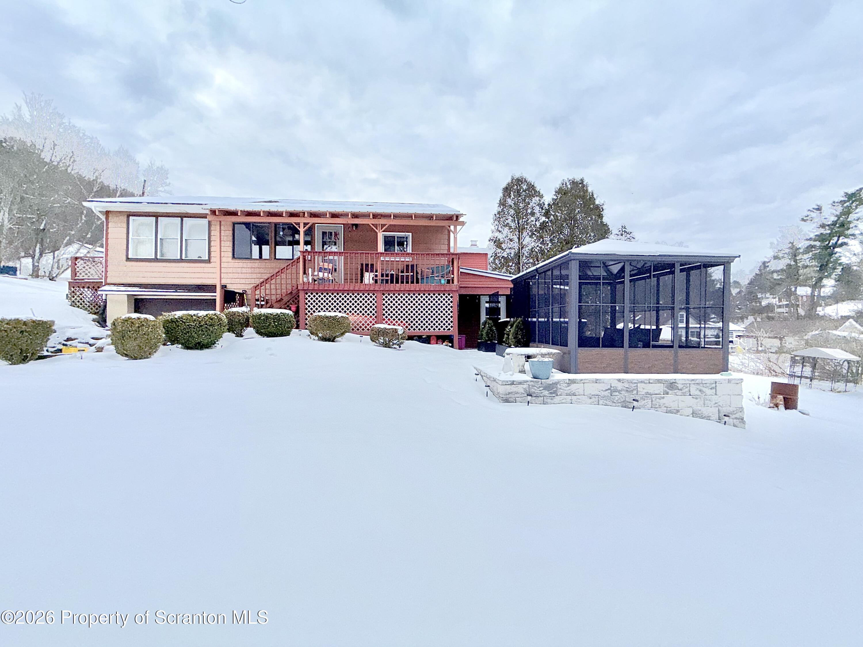 338 Bailey Street Clarks Summit, PA 18411 - Photo 19 of 24 a view of a house with a yard covered in snow