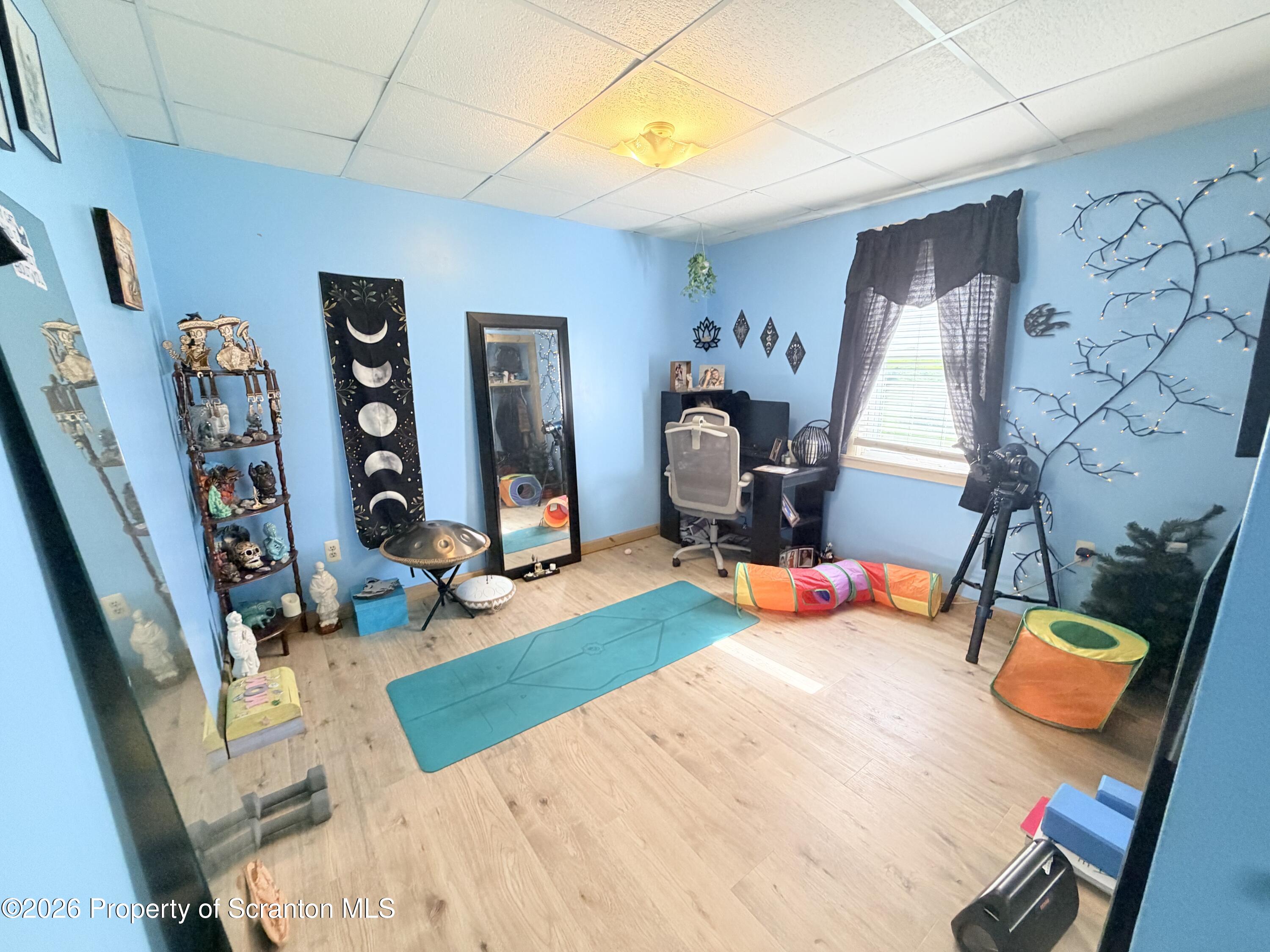 338 Bailey Street Clarks Summit, PA 18411 - Photo 20 of 24 a bedroom with furniture and a wooden floor