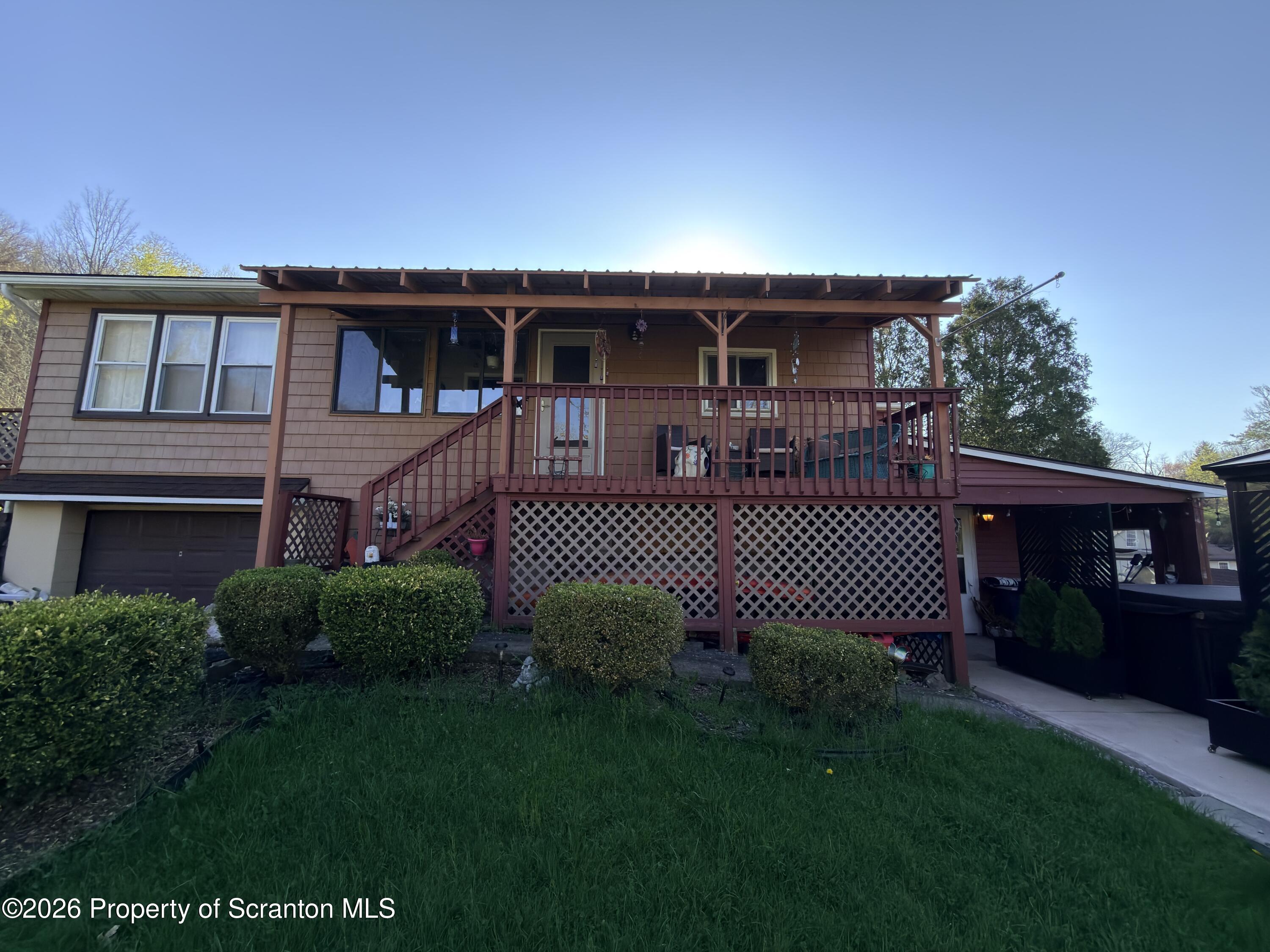 338 Bailey Street Clarks Summit, PA 18411 - Photo 24 of 24 front view of a house with a garden