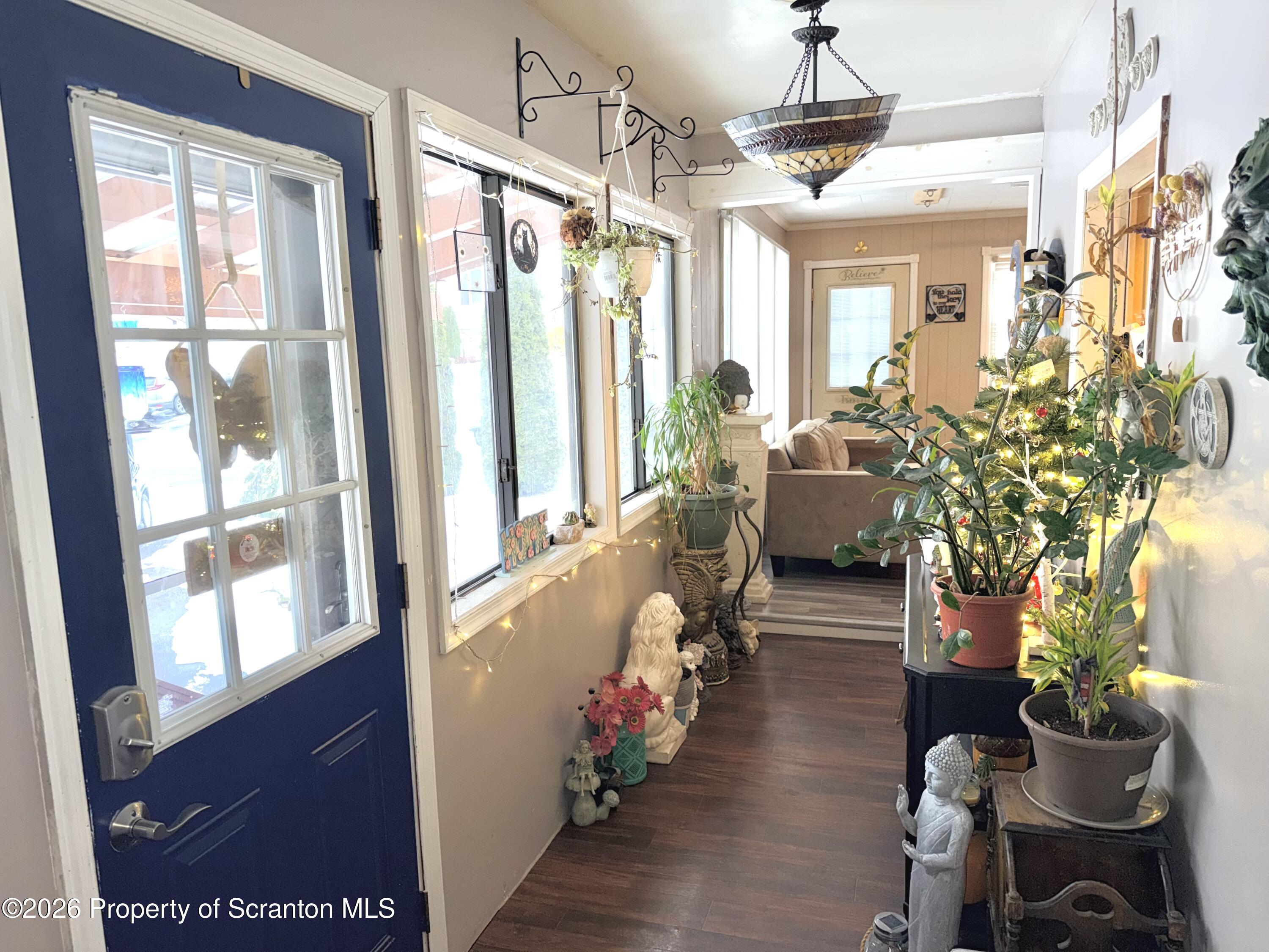 338 Bailey Street Clarks Summit, PA 18411 - Photo 4 of 24 a lobby with furniture and flowers
