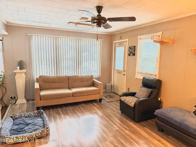 a living room with furniture and a rug