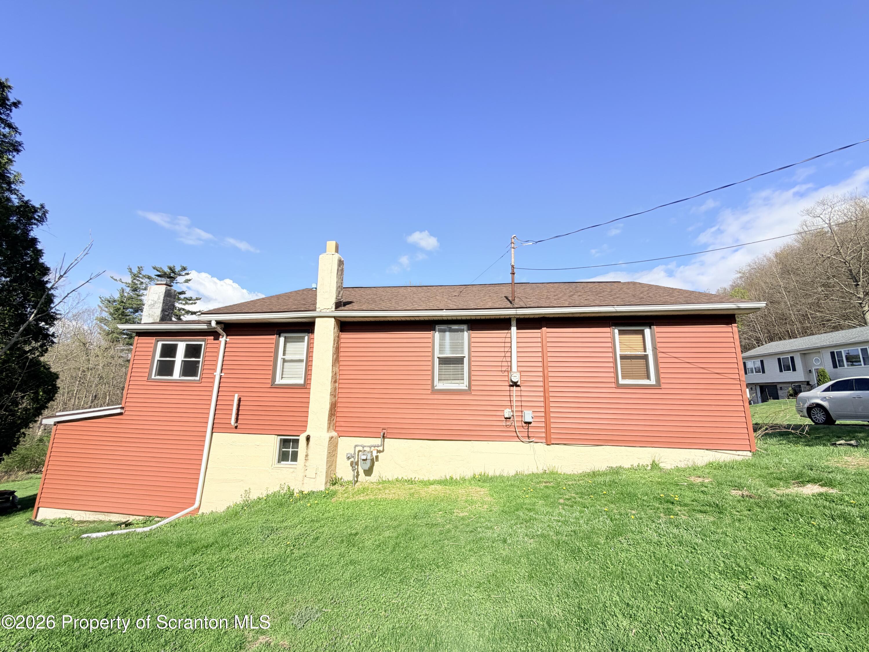 338 Bailey Street Clarks Summit, PA 18411 - Photo 7 of 24 a front view of a house with garden