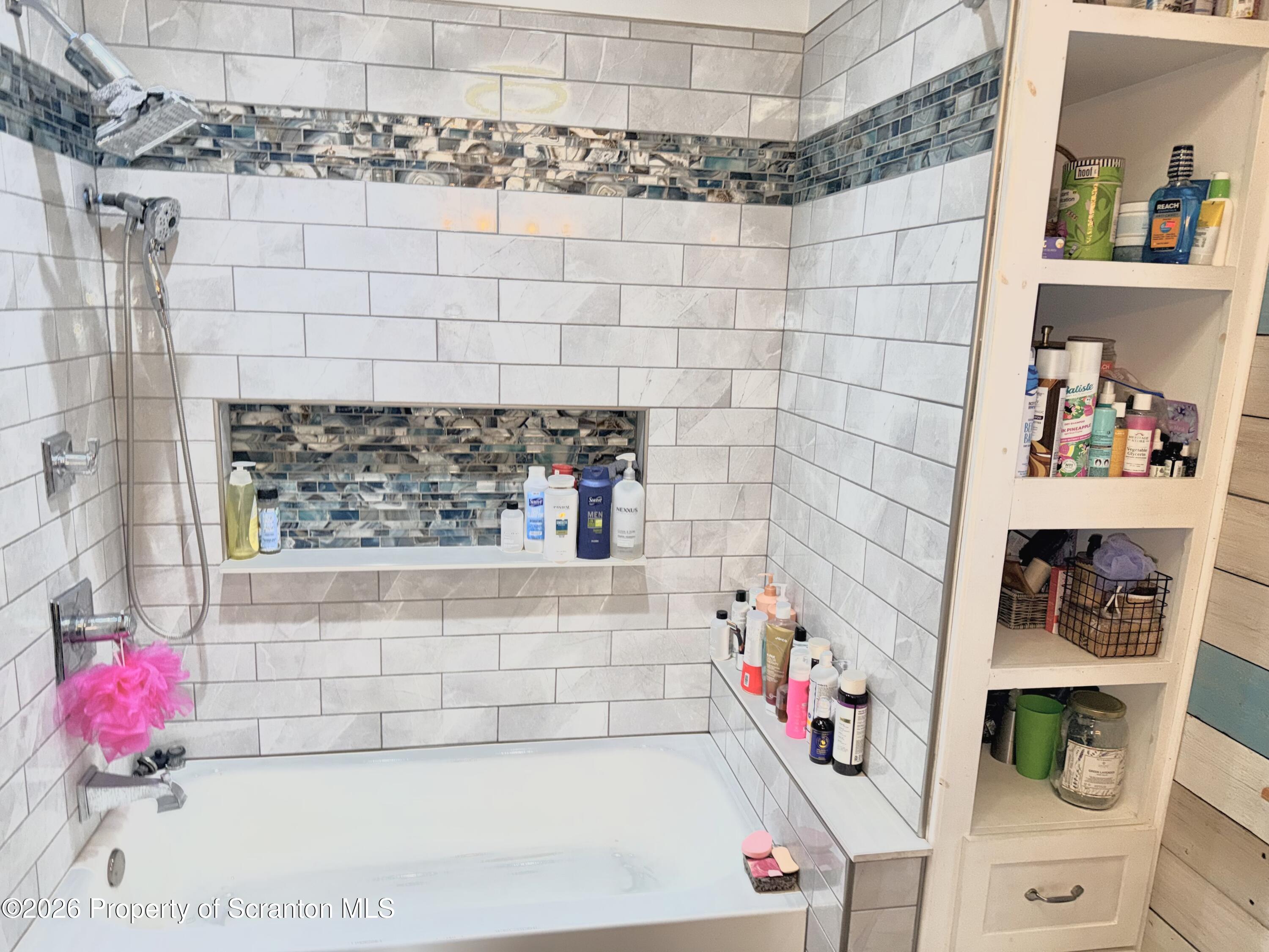 338 Bailey Street Clarks Summit, PA 18411 - Photo 9 of 24 a bathroom with a bathtub and shower