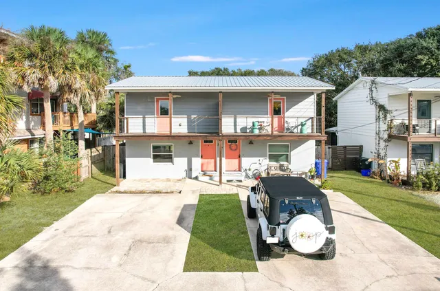 a view of a chair and tables in the patio of the house