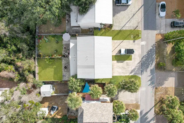 an aerial view of a house with outdoor space