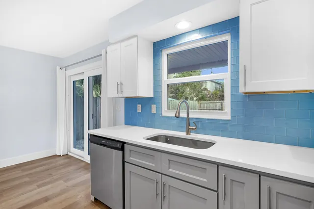 a kitchen with a sink and a window