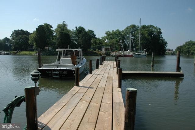 24611 Long Haul Road St. Michaels, MD 21663 - Photo 14 of 16 a view of a lake with boats and trees in the background