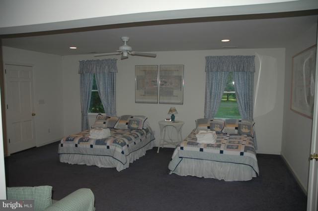 24611 Long Haul Road St. Michaels, MD 21663 - Photo 3 of 16 a spacious bedroom with bed and a window